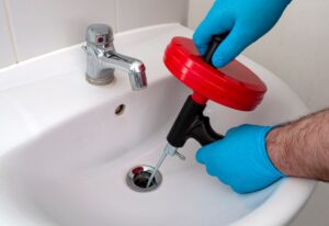 Clearing drain with plumber snake