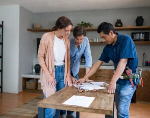 Plumber talking to clients