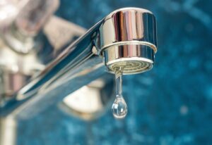 Water dripping from leaky faucet